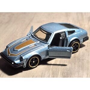 2020 Matchbox Moving Parts GTT20 '82 Datsun 280‎ ZX Sky Blue Mtflk/Gold w/5sp NM